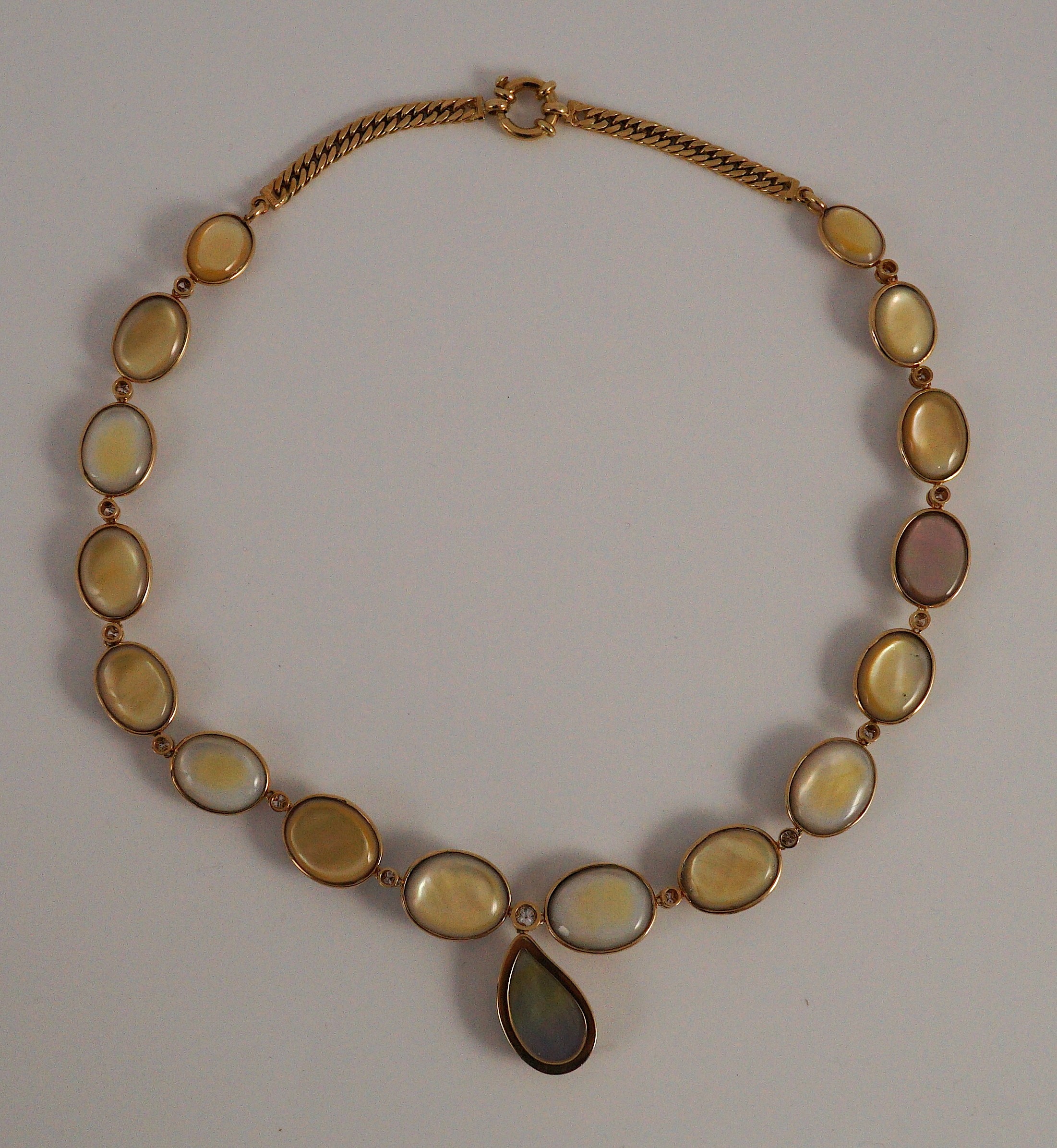 A cased modern single strand graduated shaped mabe pearl and round brilliant cut diamond set drop necklace, with 18ct gold clasp and chain section